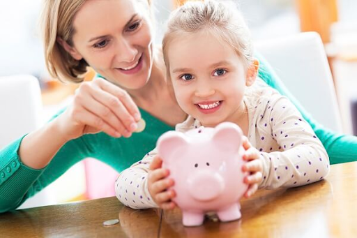 Girl holding piggy bank